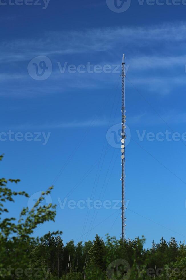 Transmitter tower in Sweden in front of blue sky photo