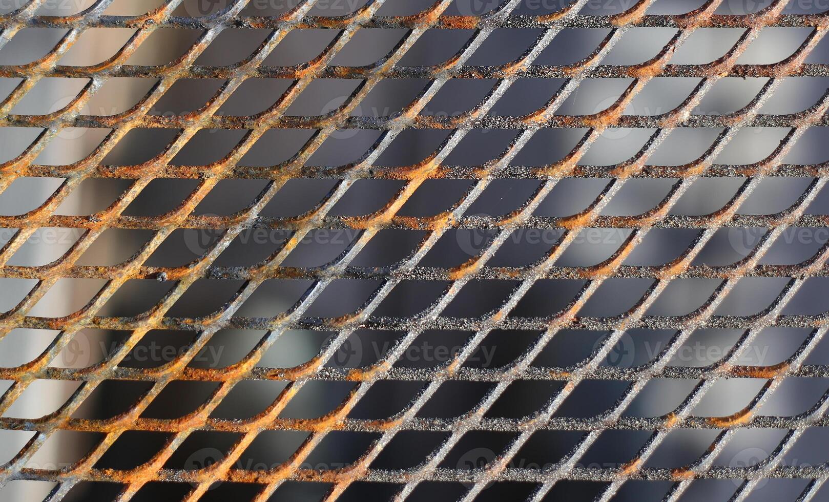 Close up of a slightly rusty cooking grate photo