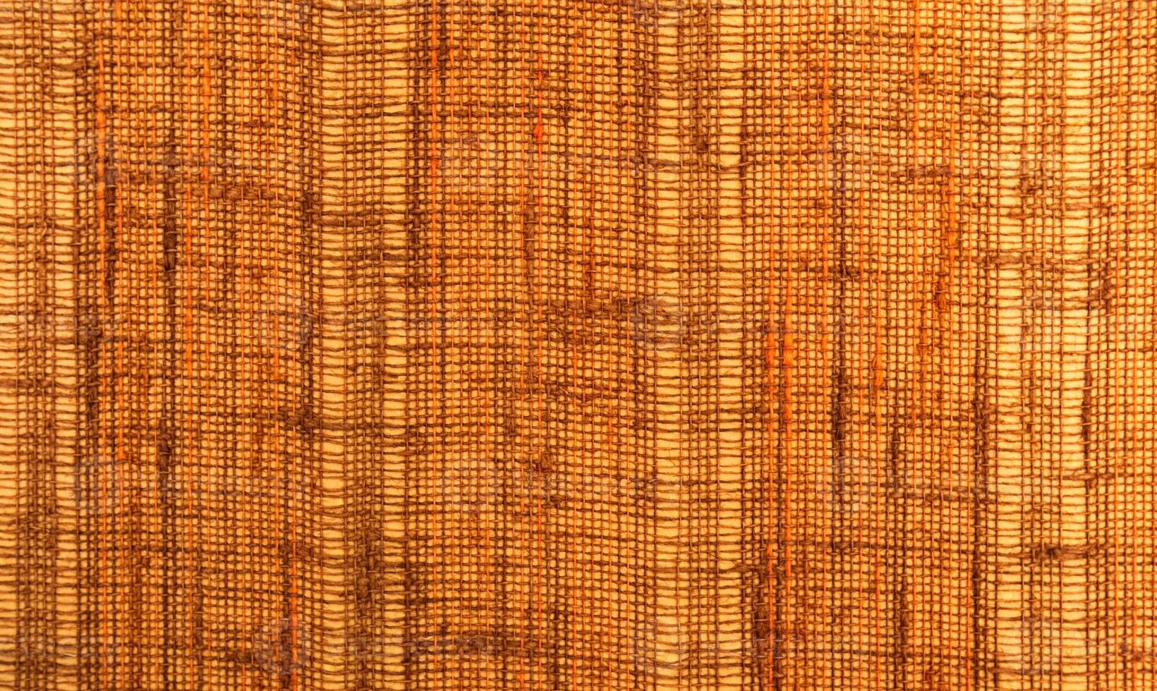 Close-up of a textile surface with orange and brown color photo
