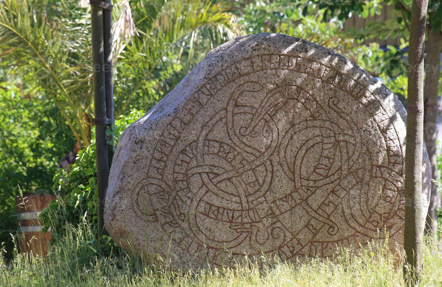 Historic rune stone at the castle in Trelleborg, Sweden photo