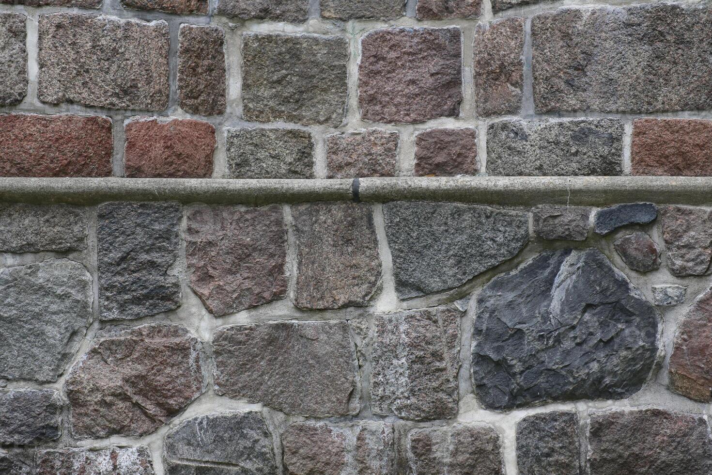 Stone wall with an horizontal edge and two styles photo