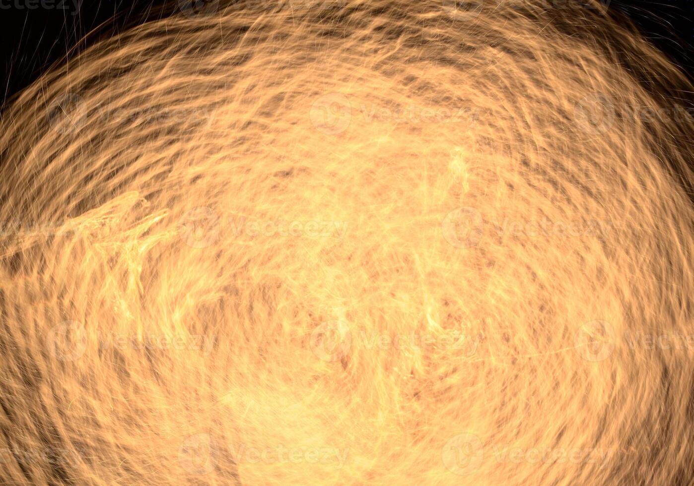 Long exposure shot of moving burning torches and fire photo