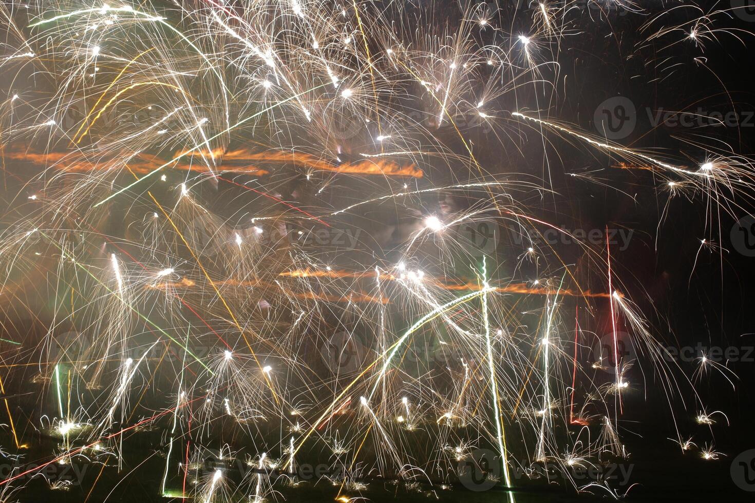 Long exposure shot of fireworks in different directions photo