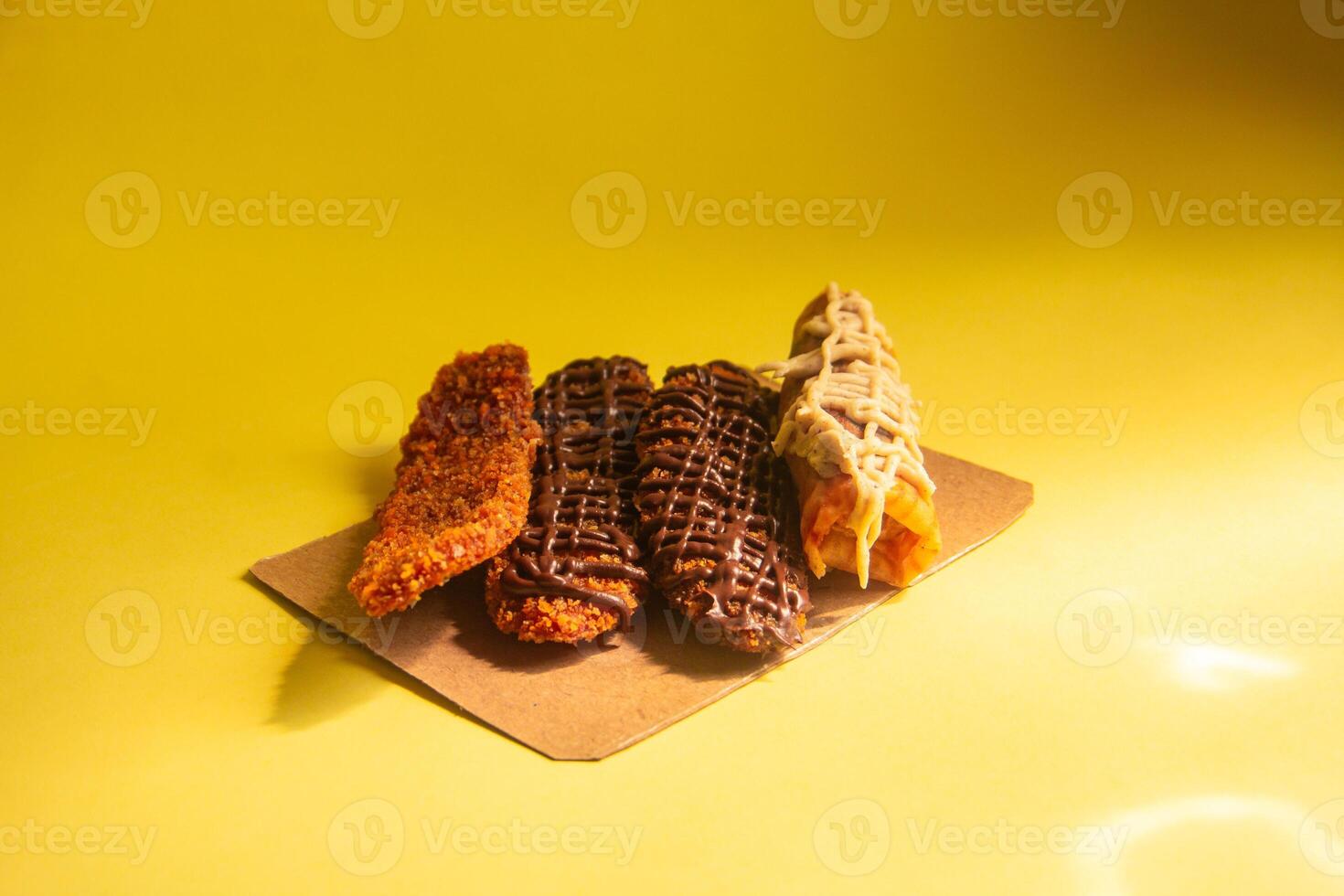 Crispy banana cake, sweet banana cake with sweet topping on a yellow background photo