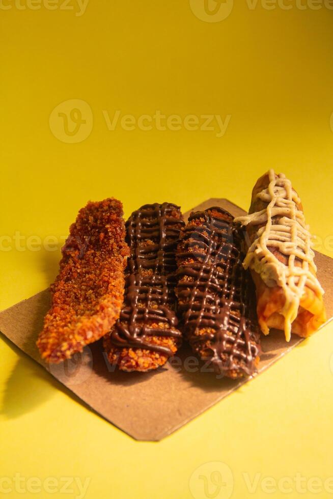 Crispy banana cake, sweet banana cake with sweet topping on a yellow background photo