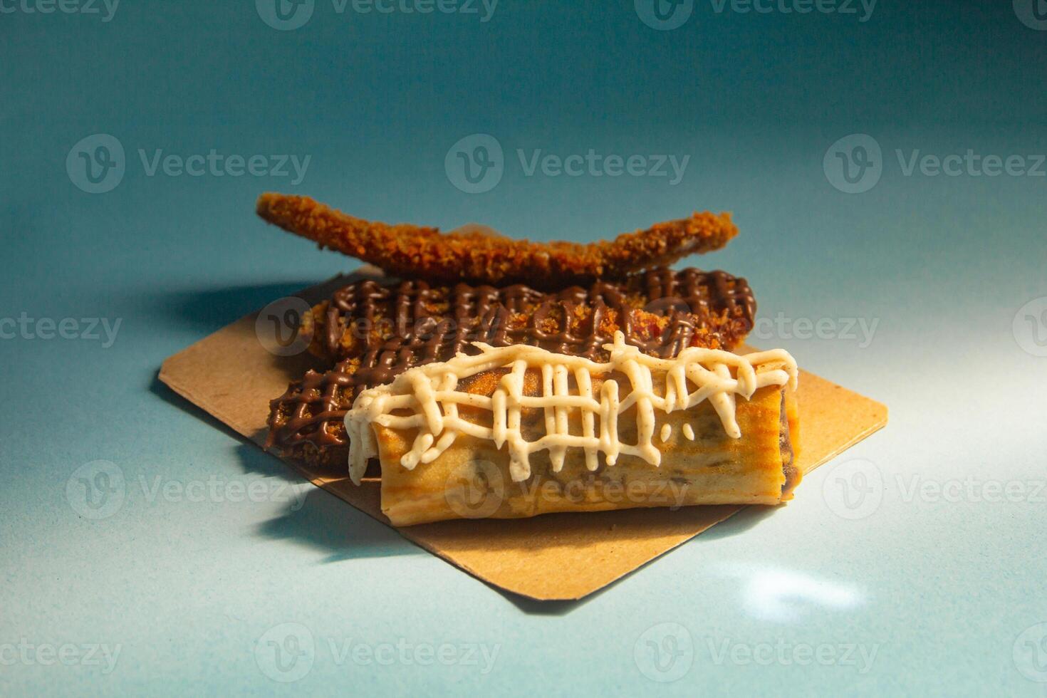 Crispy banana cake, sweet banana cake with sweet topping on a blue background photo