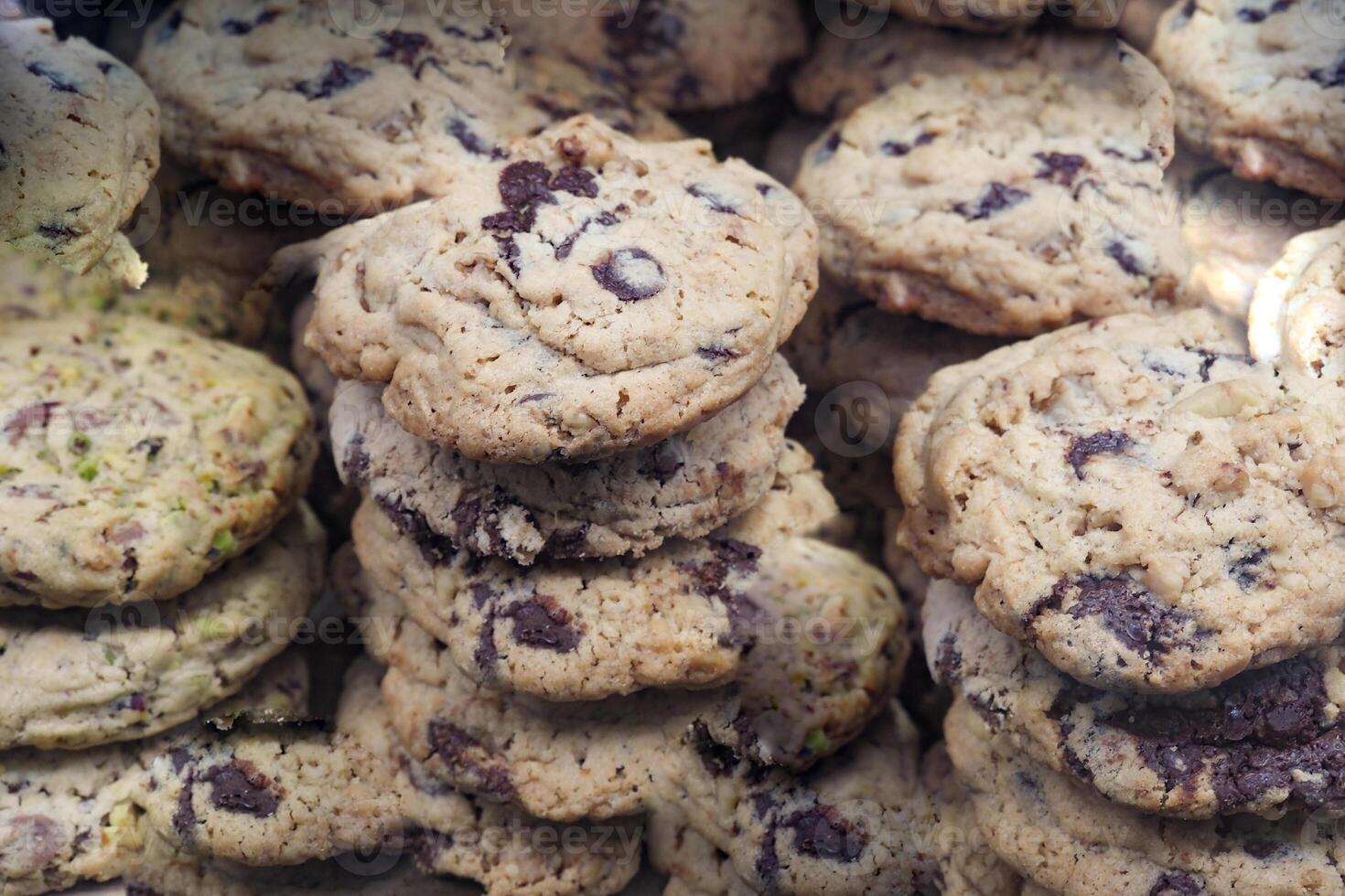 A Towering Pile of Deliciously Assorted Cookies for Everyone to Enjoy photo