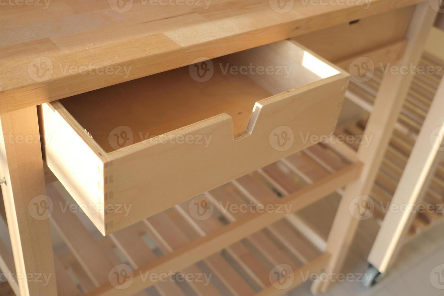This is a Modern Wooden Kitchen Cart which features an Open Drawer for storage photo