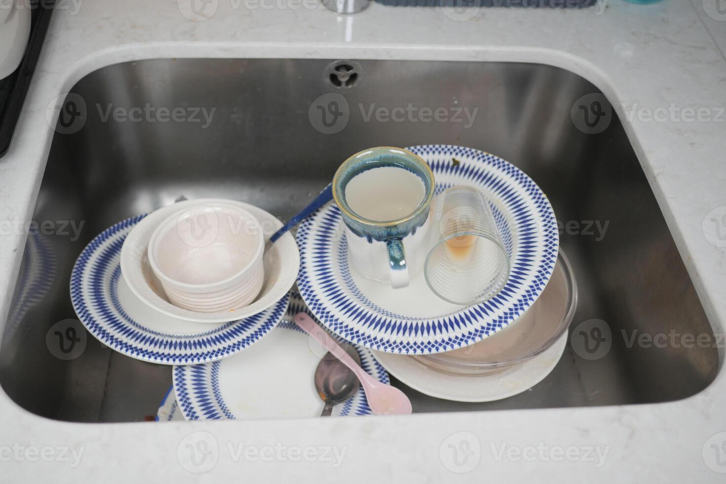 Dirty dishes in the sink photo
