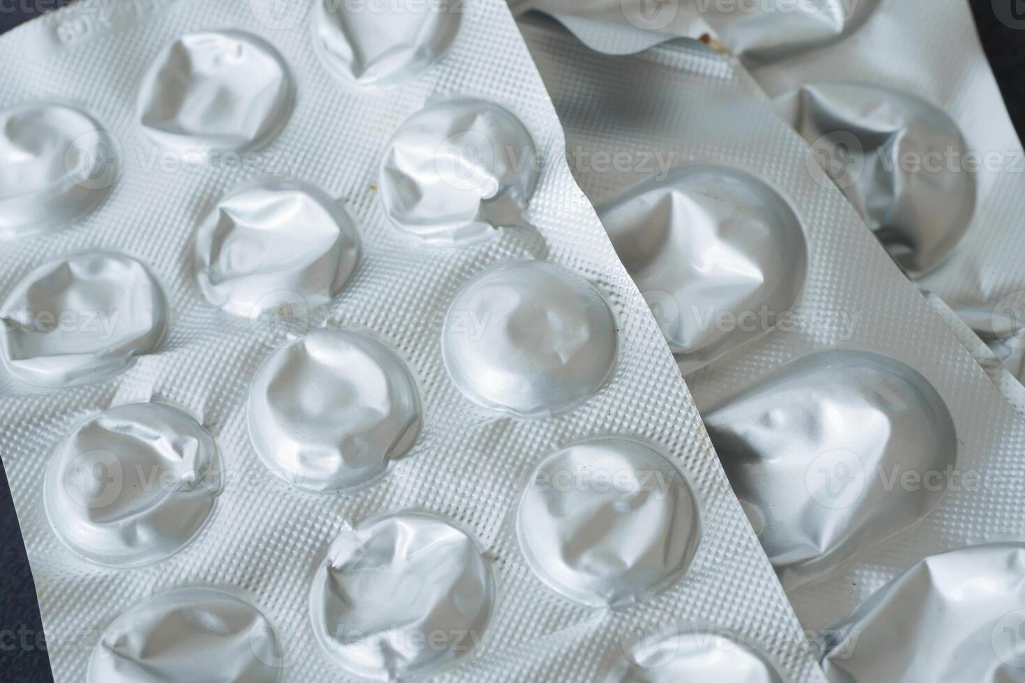 A CloseUp Image Featuring Empty Blister Packs of Various Medications photo