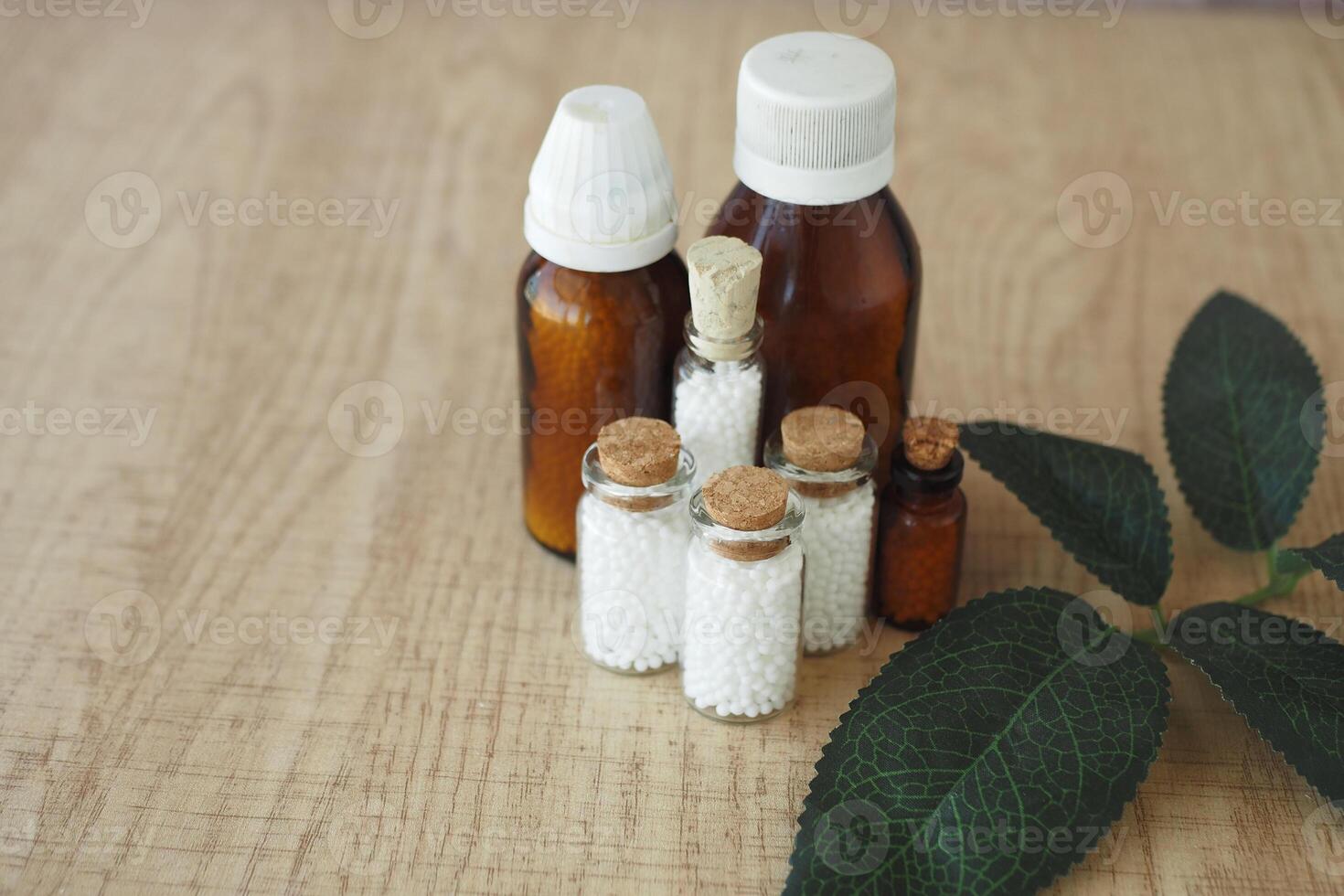 Homeopathic pills containers on a table photo