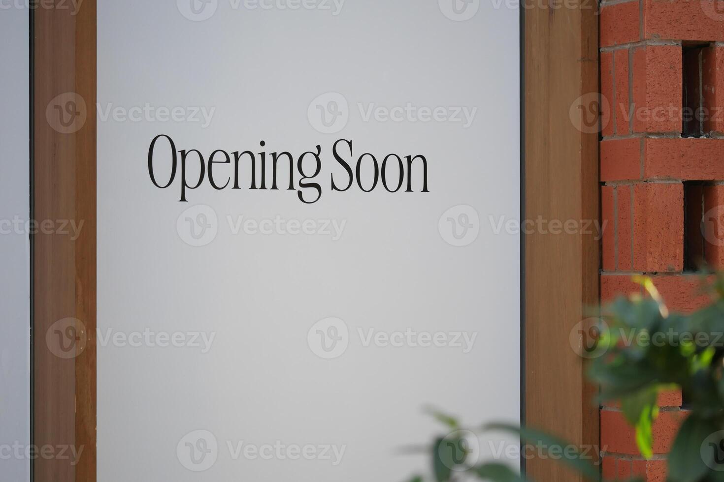 Exciting Storefront Announcement We Will Be Opening Soon with Signage Displayed photo
