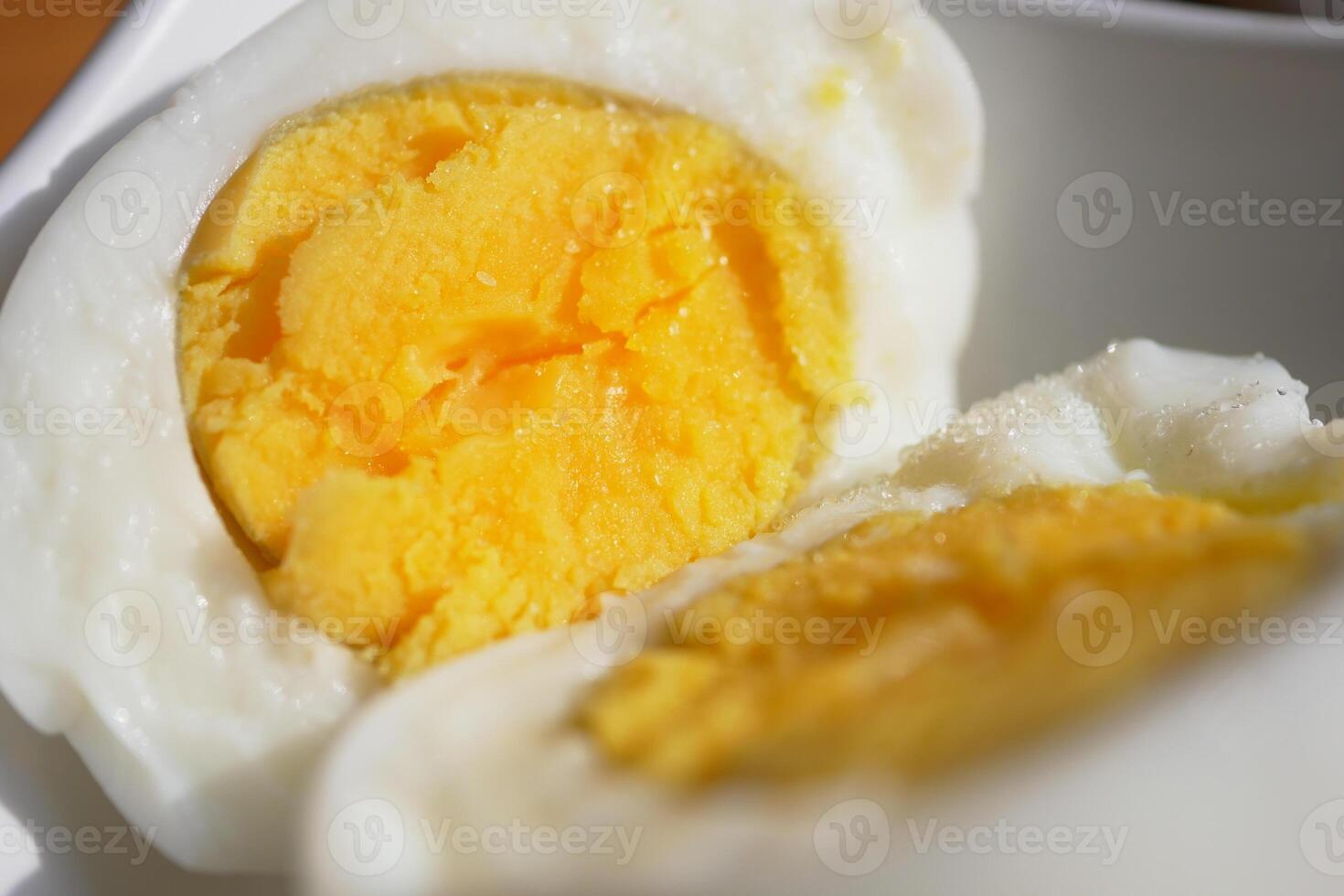 An UpClose Image of SoftBoiled Eggs Beautifully Sliced in Half photo