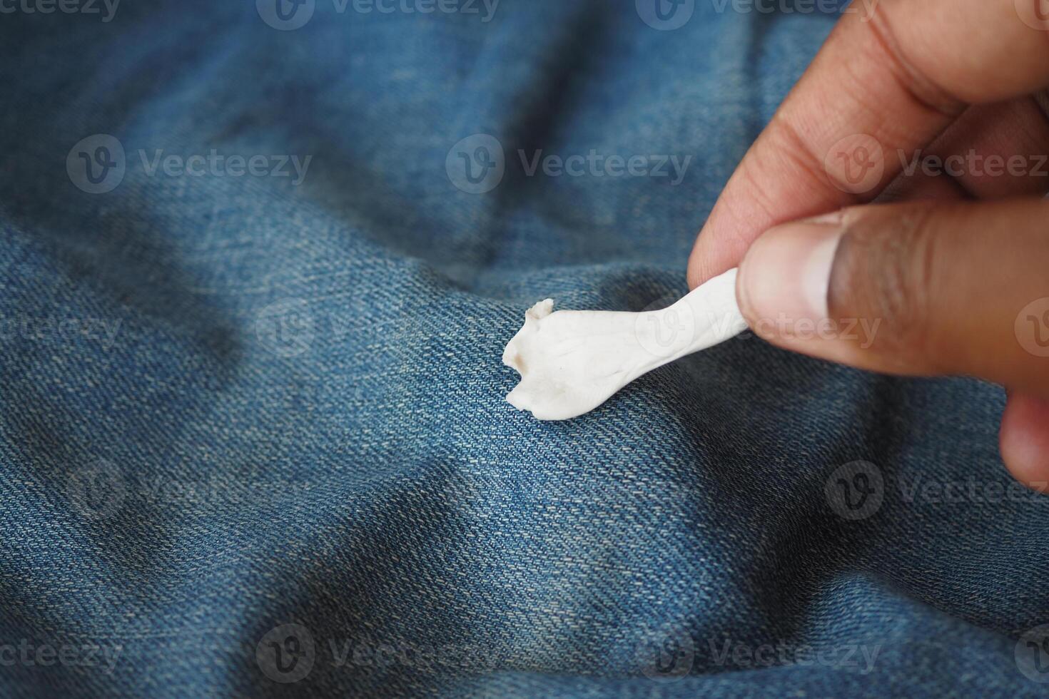 Detailed instructions for effectively removing chewing gum from fabric, with closeup view focus photo