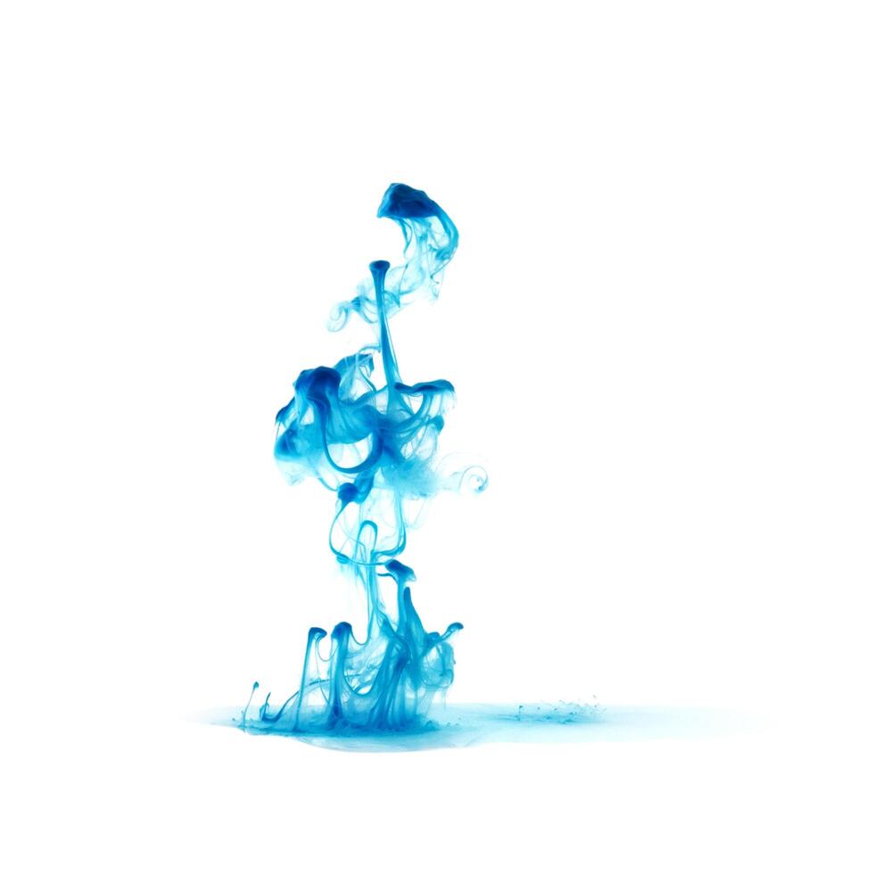 Blue ink dropped in to water isolated white background. Abstract color dissolving in water photo
