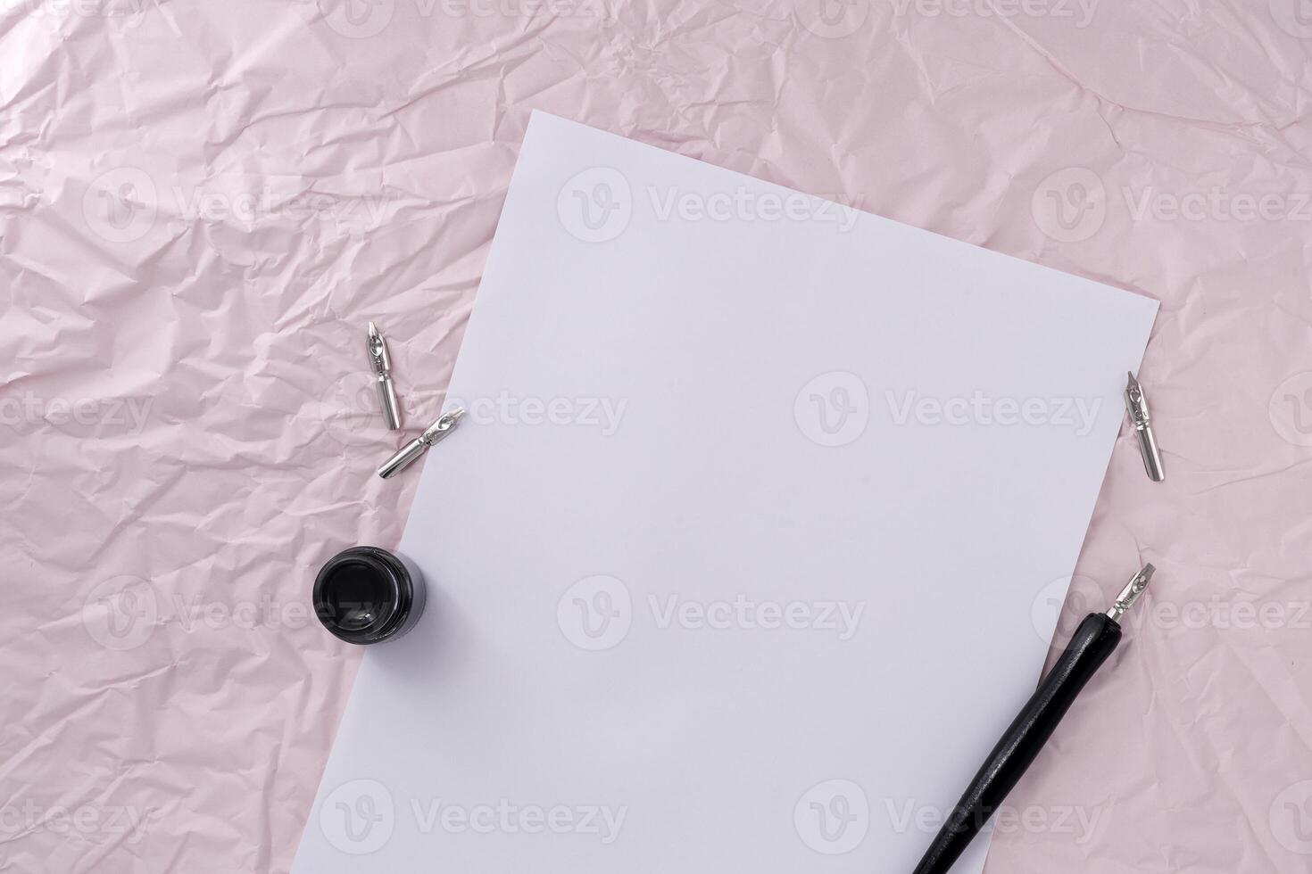 A paper with dip pen on wrinkled paper texture background. photo