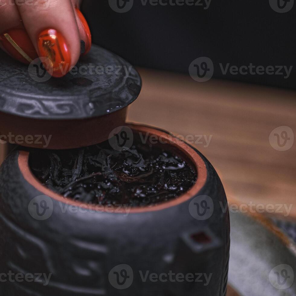 Experience an elegant tea ceremony with a beautifully crafted traditional teapot photo