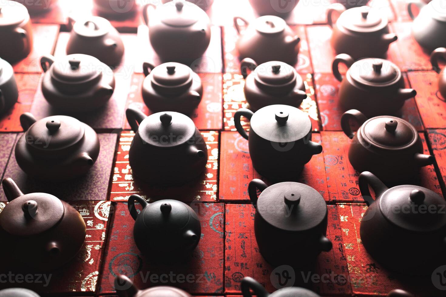 A Beautiful and Elegant Teapots Arrangement Captured in Inviting Warm Lighting Atmosphere photo