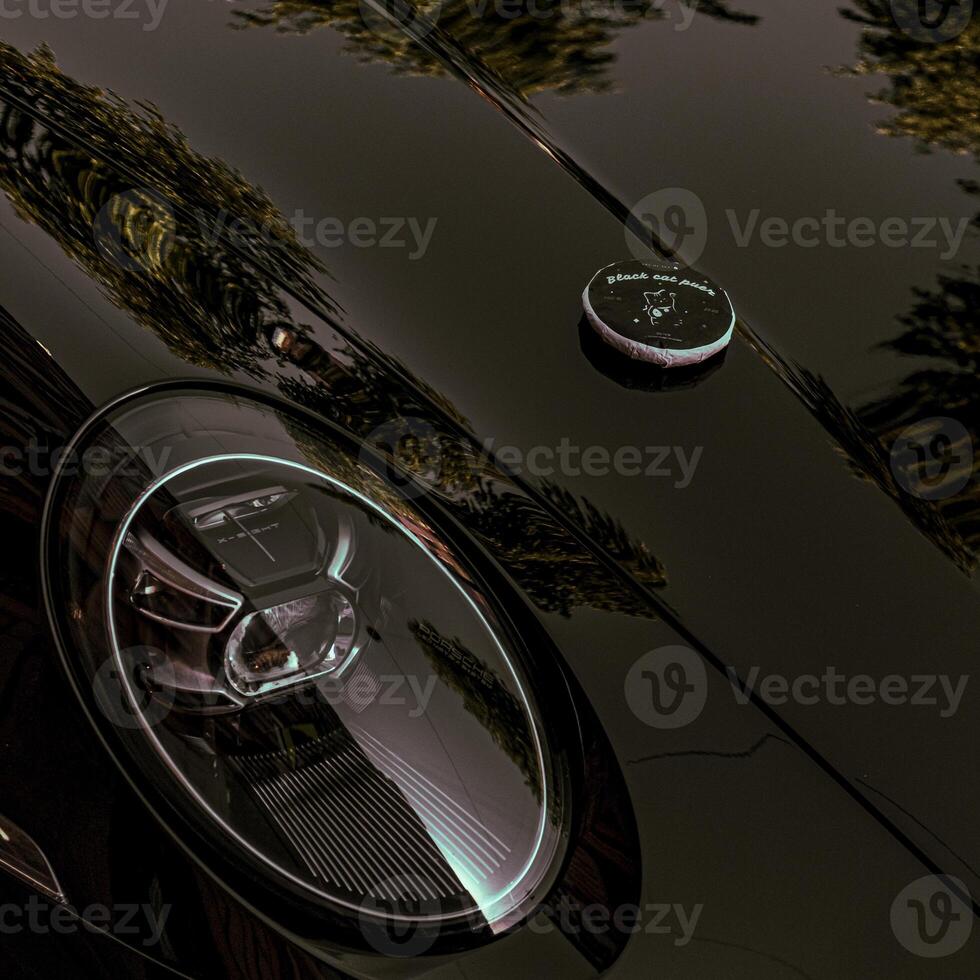 A striking and refined design of a modern car featuring a luxurious and glossy finish photo