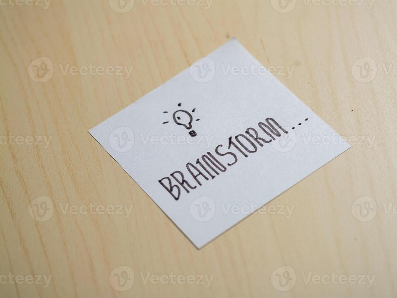 Brainstorming ideas for creative projects office space note-taking indoor close-up innovation photo