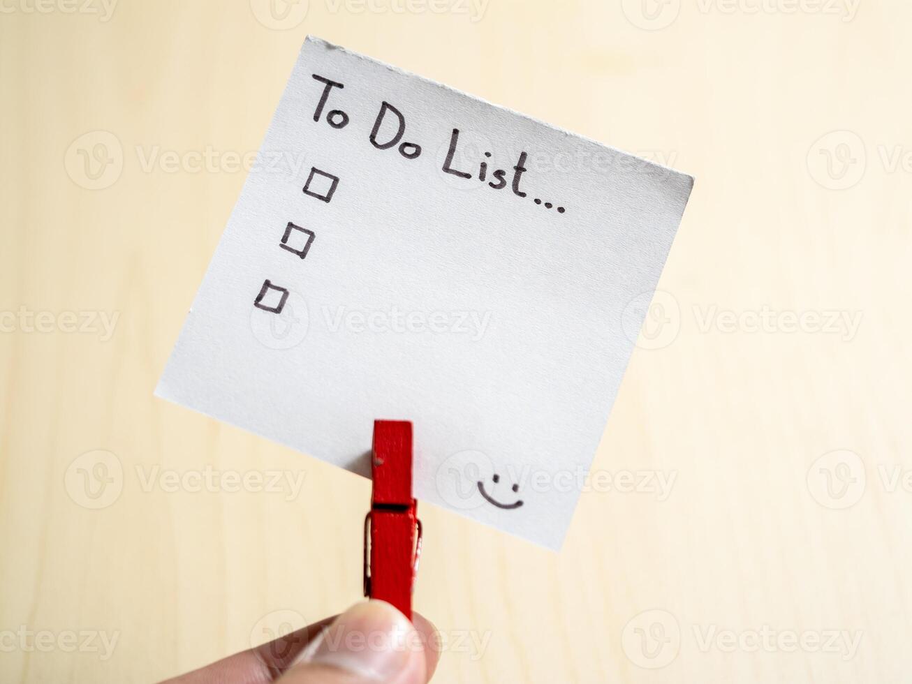 Organizing your day to-do list essentials home office note minimalist close-up productivity tips photo