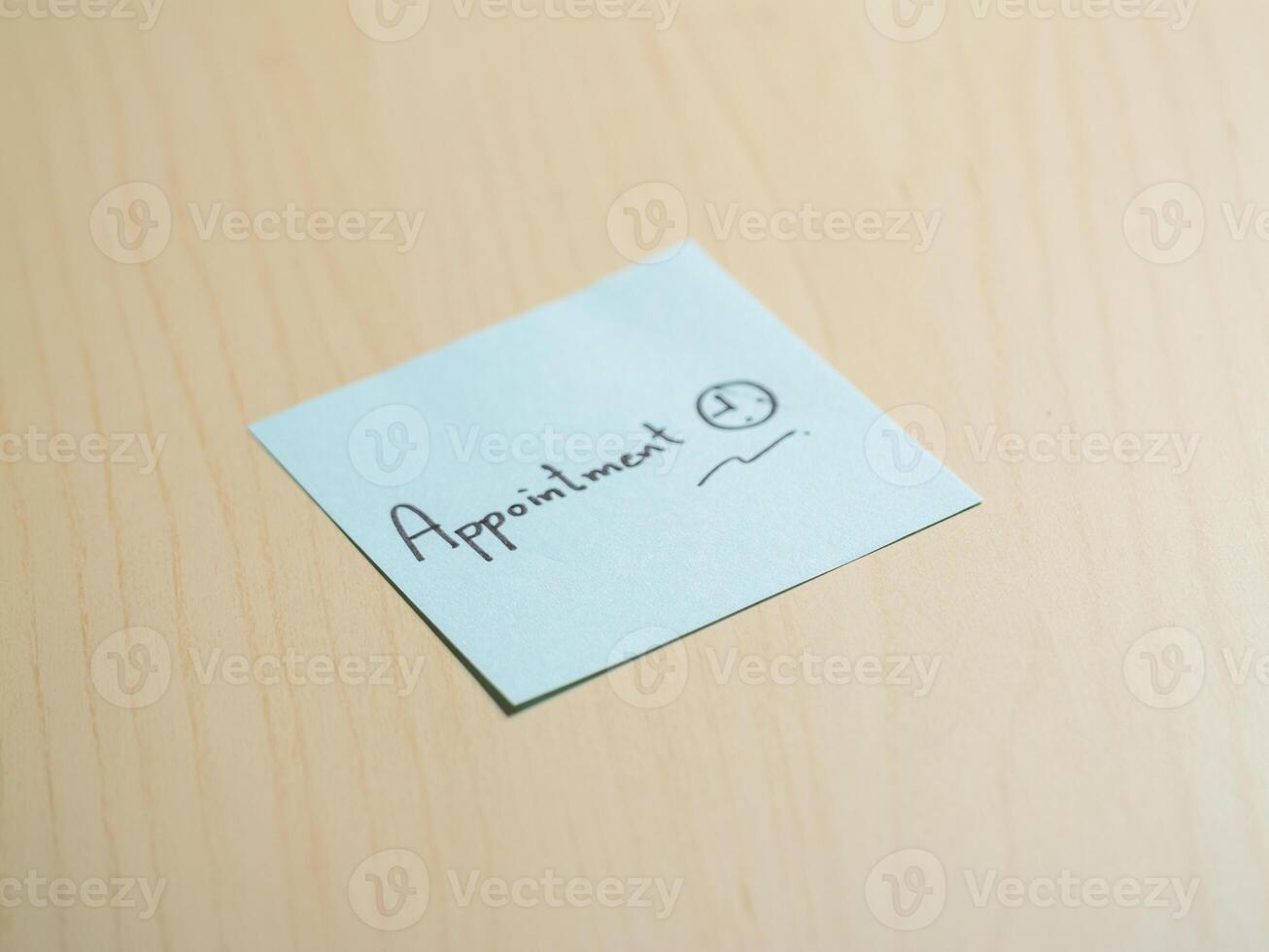 Close-up of a minimalist sticky note reminder on office desk for productivity photo