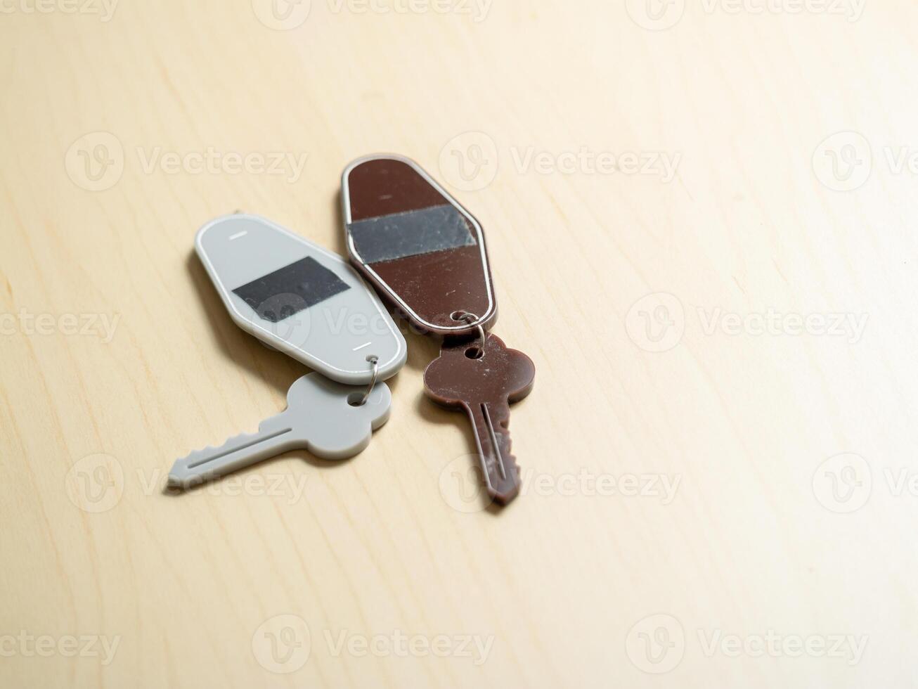 Key collection on wooden surface home minimalist elevated view everyday objects photo