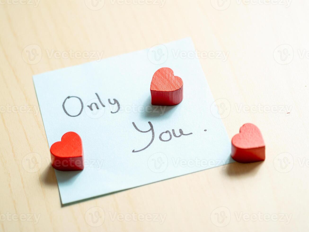Heart-shaped tokens and sentimental notes a close-up of romantic gestures in love photo