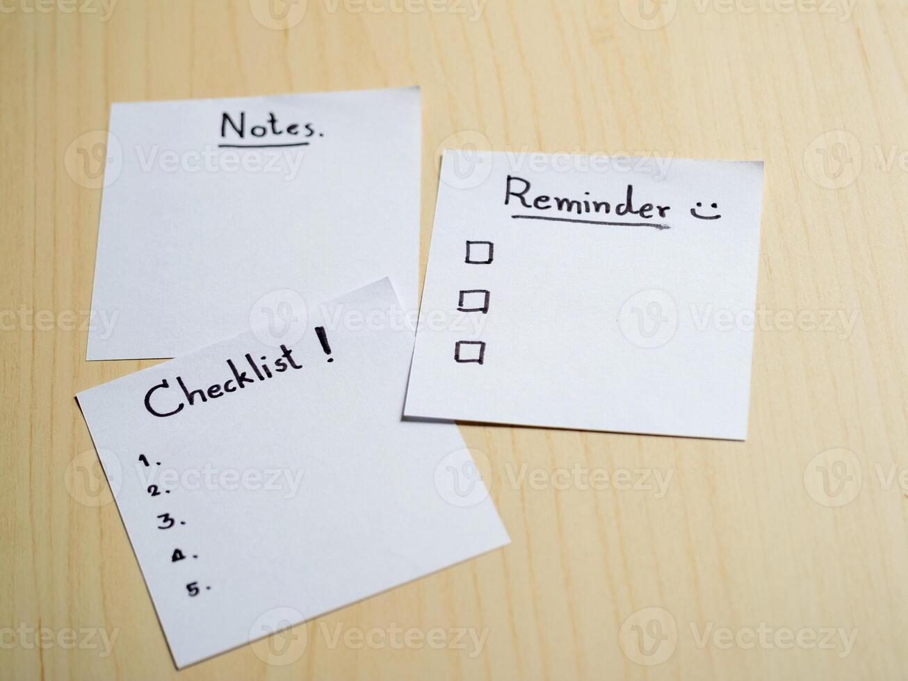 Organizing your life checklist notes and reminders on a wooden table home office conceptual view photo
