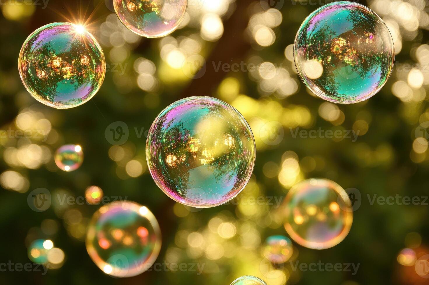 Soap bubbles floating in the air reflecting sunlight photo