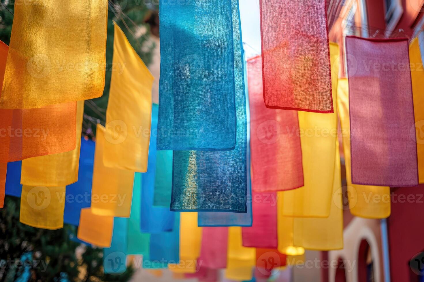 Colorful fabrics hanging outdoors creating a vibrant backdrop photo