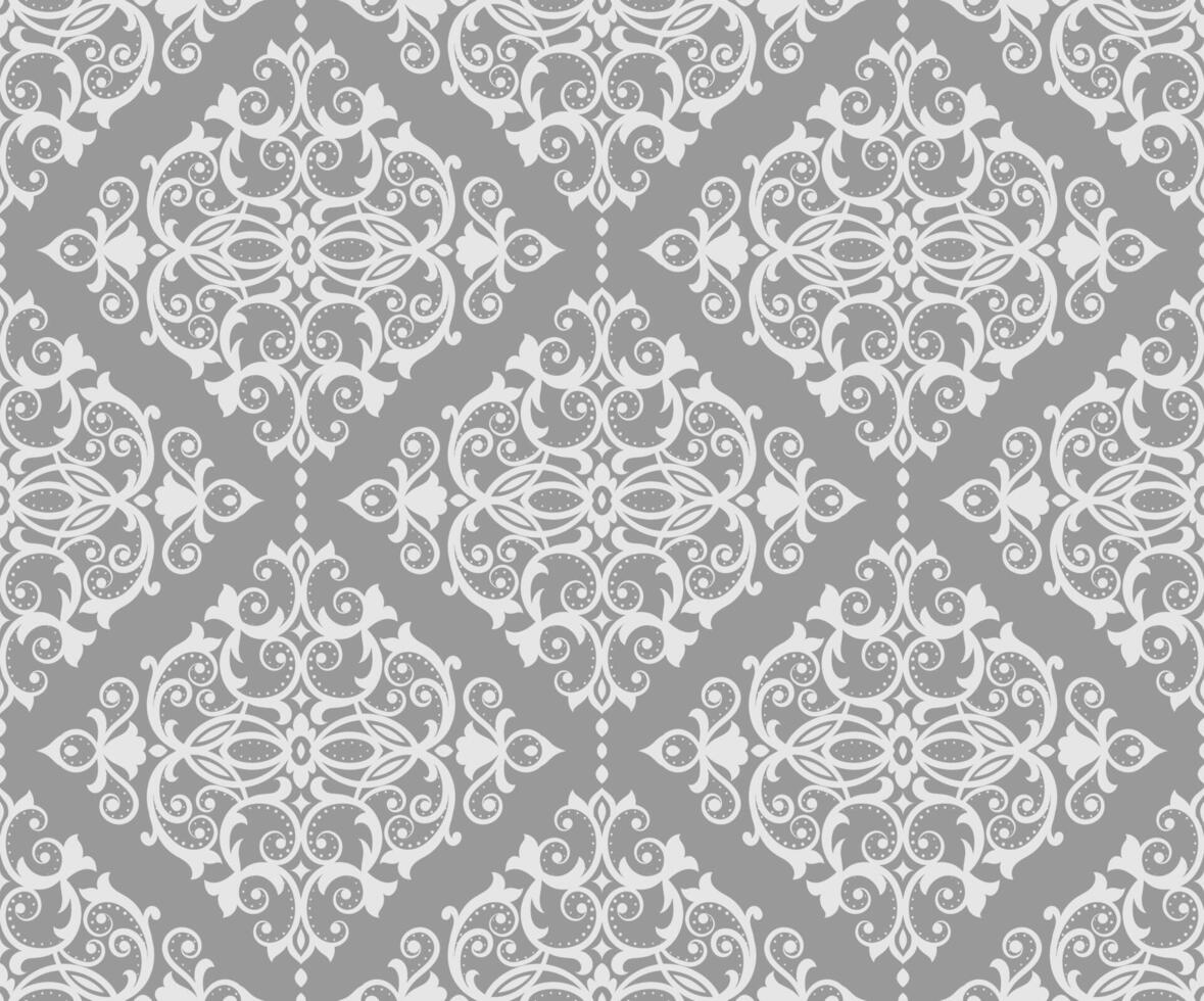Wallpaper in the style of Baroque. A seamless background. White and grey floral ornament. vector