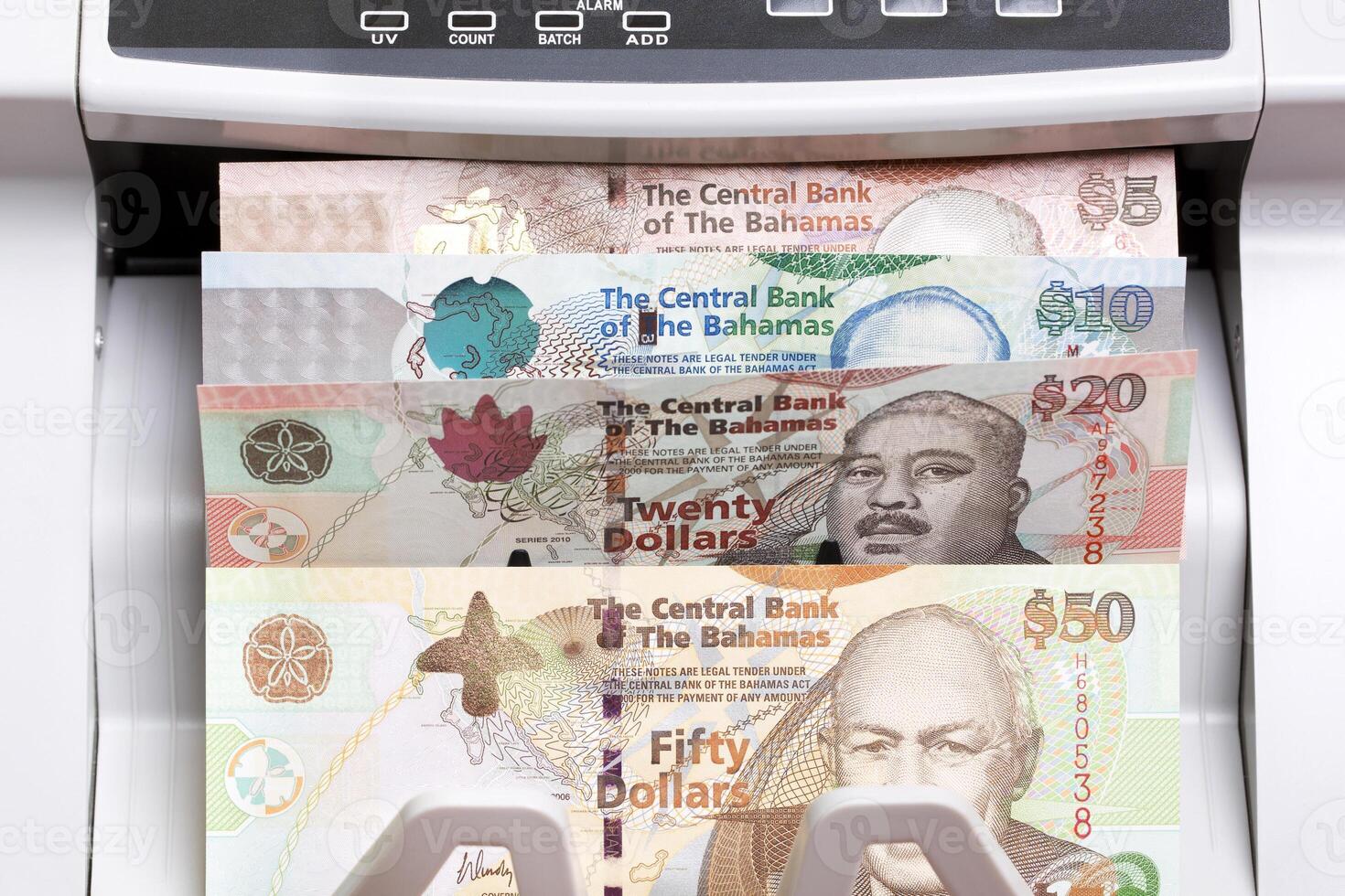Bahamian dollar in the counting machine photo