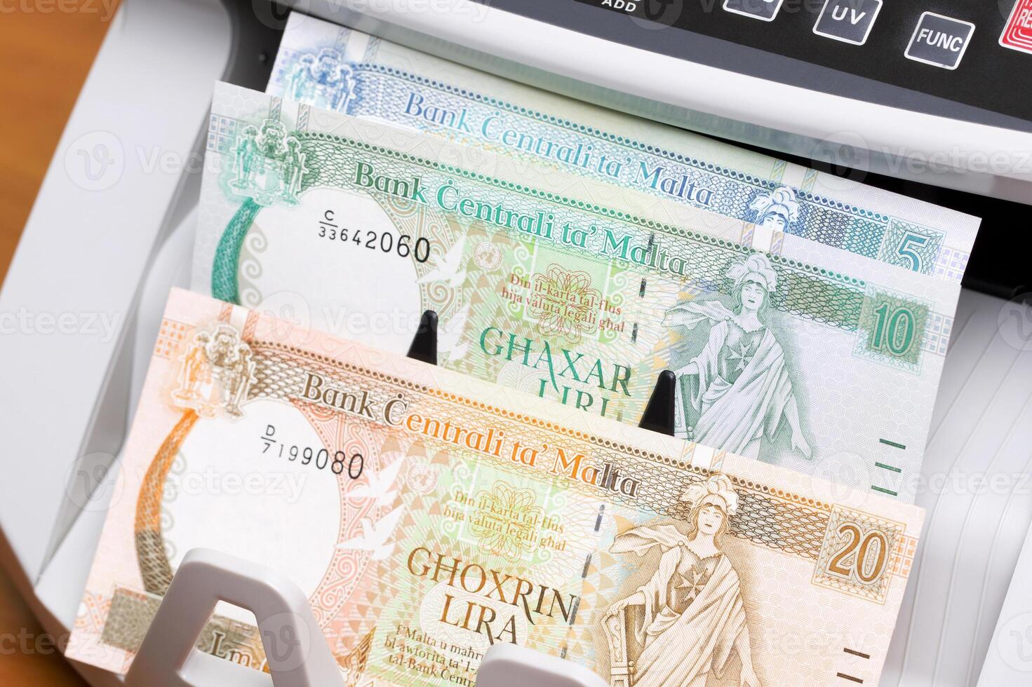 Maltese lira in the counting machine photo