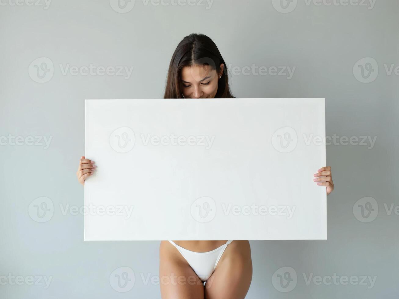 Minimalist composition of a woman holding a blank white board in a bright setting, perfect for mockups and branding visuals photo