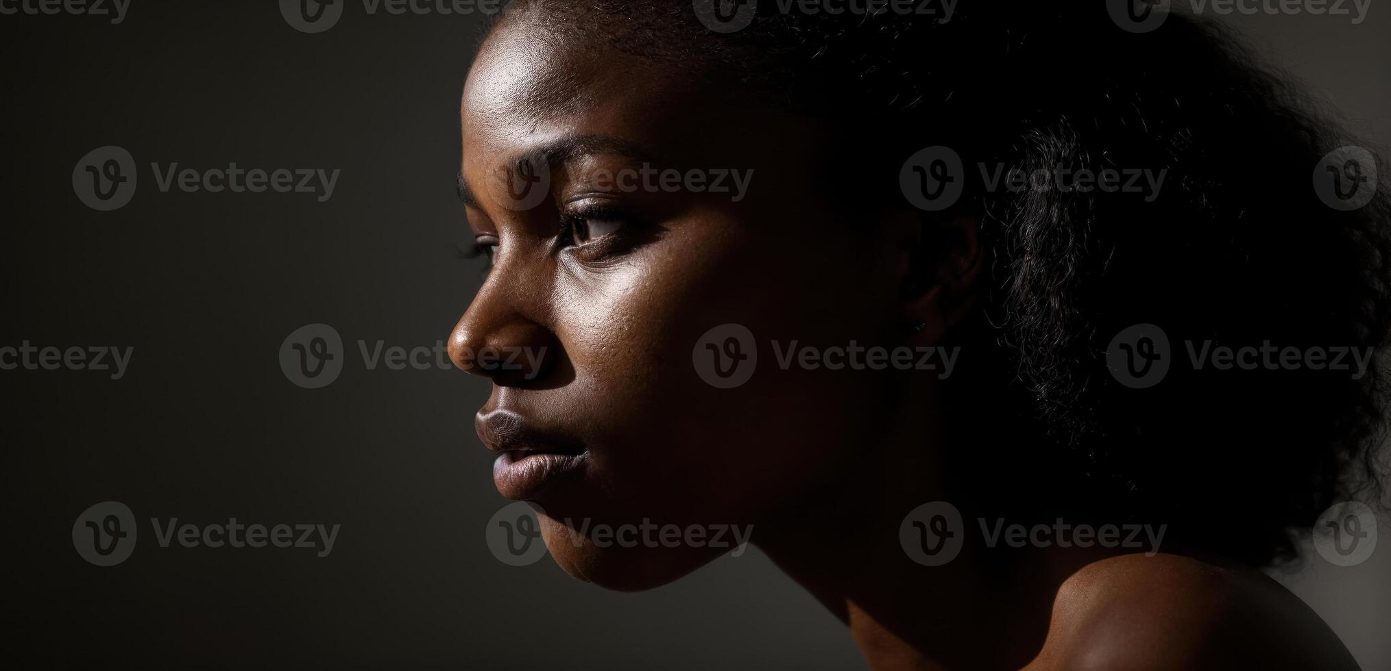 A woman with dark skin and dark hair photo