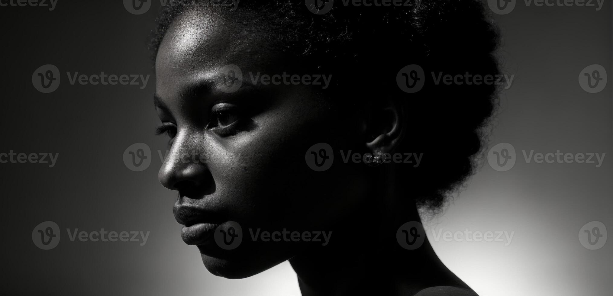 A black woman with a dark background photo