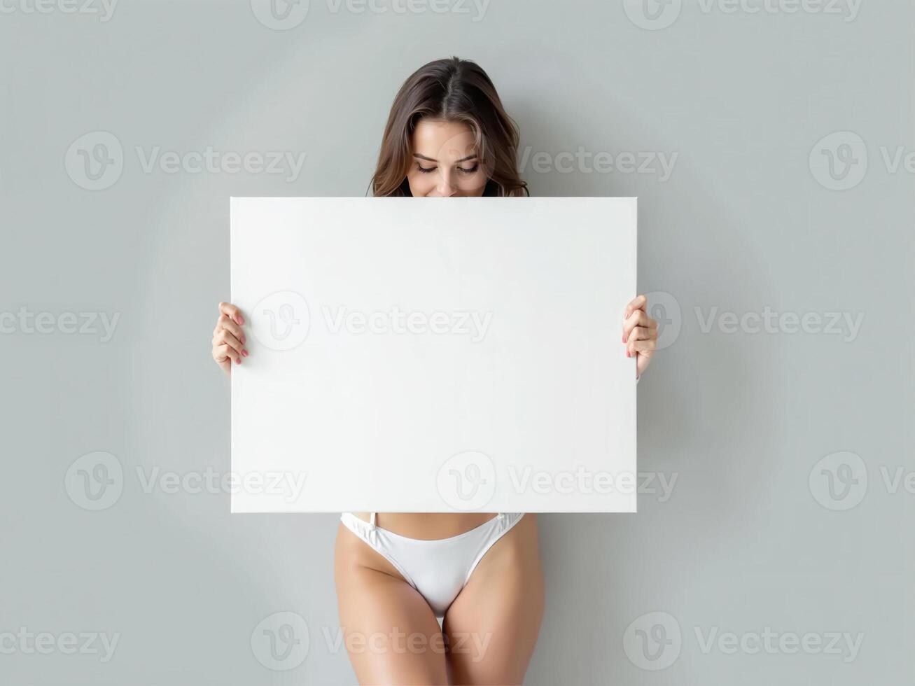 Minimalist composition of a woman holding a blank white board in a bright setting, perfect for mockups and branding visuals photo