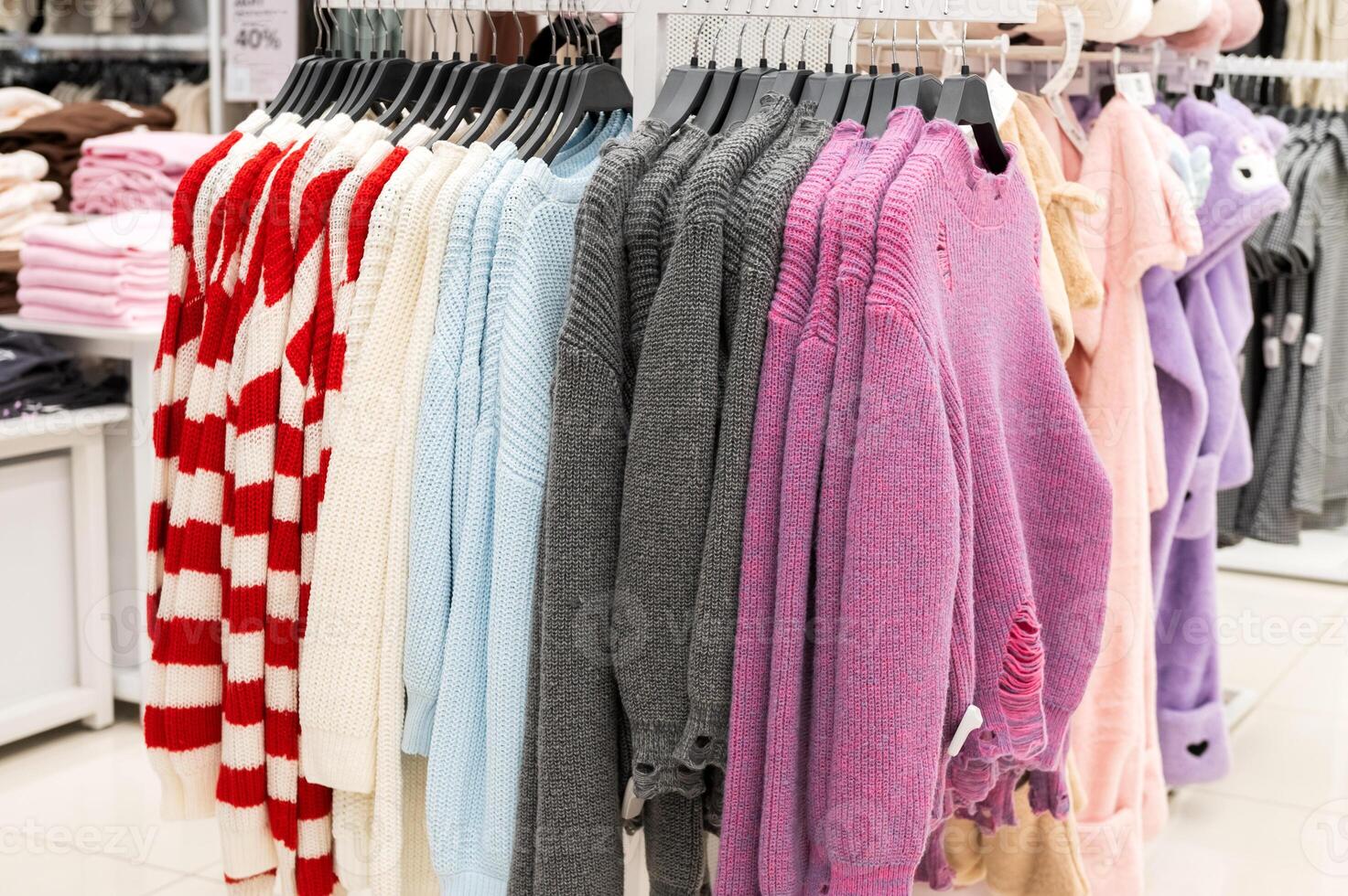 Colorful Knitwear Display in Fashion Retail Store photo