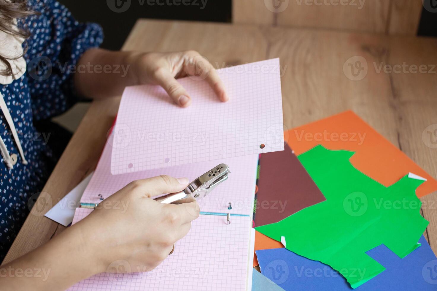 Child Engaged in Creative Paper Crafting Activity photo
