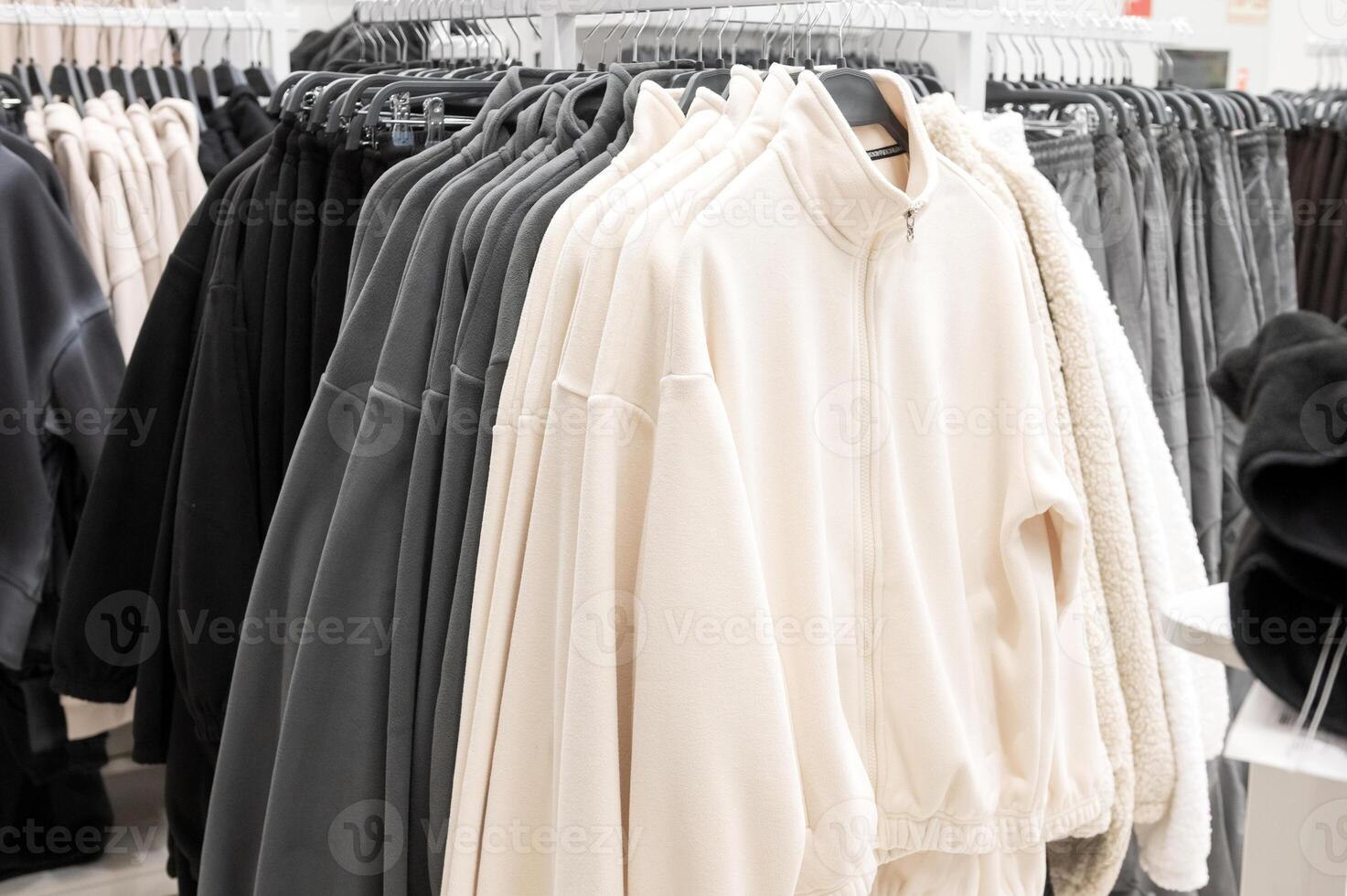 Casual Clothing Racks in Modern Apparel Store photo