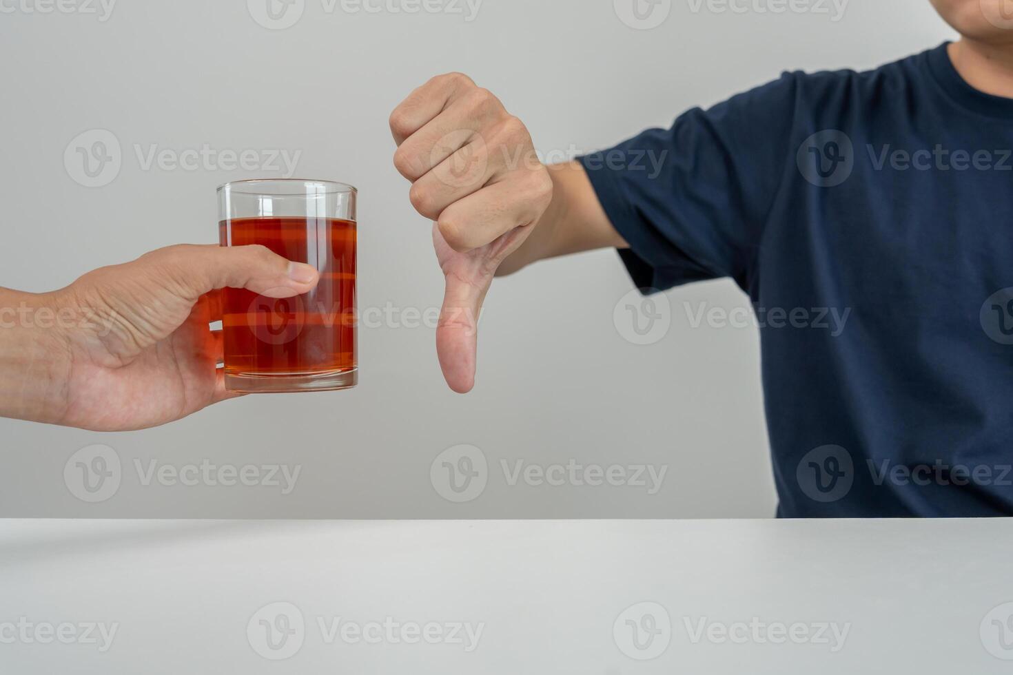 man refuses say no and avoid to drink an alcohol whiskey, stopping hand sign male, alcoholism treatment, alcohol addiction, quit booze, Stop Drinking Alcohol. Refuse Glass liquor, unhealthy, reject photo