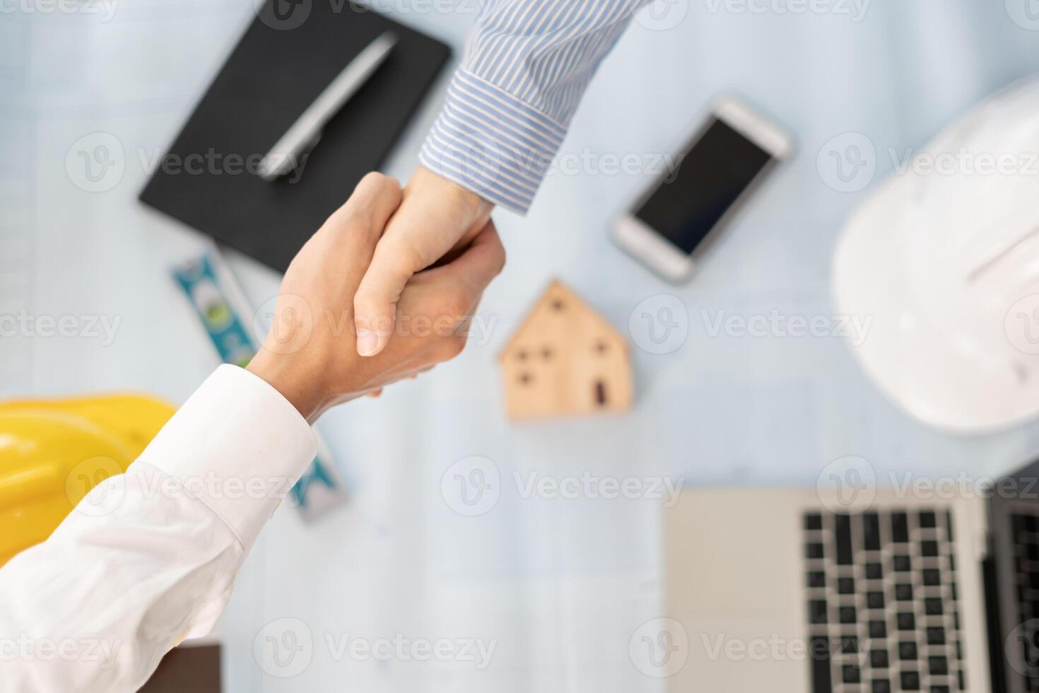 Construction team hands shaking greeting start up plan new project contract in office center at construction site, industry ,architecture, partner, teamwork, agreement, property, contac photo