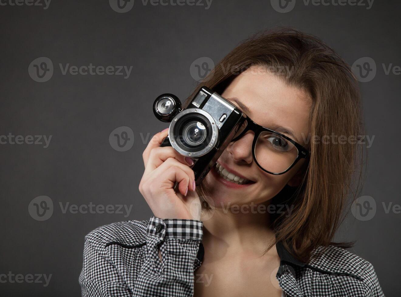 Portrait of the teen girl with old camera photo