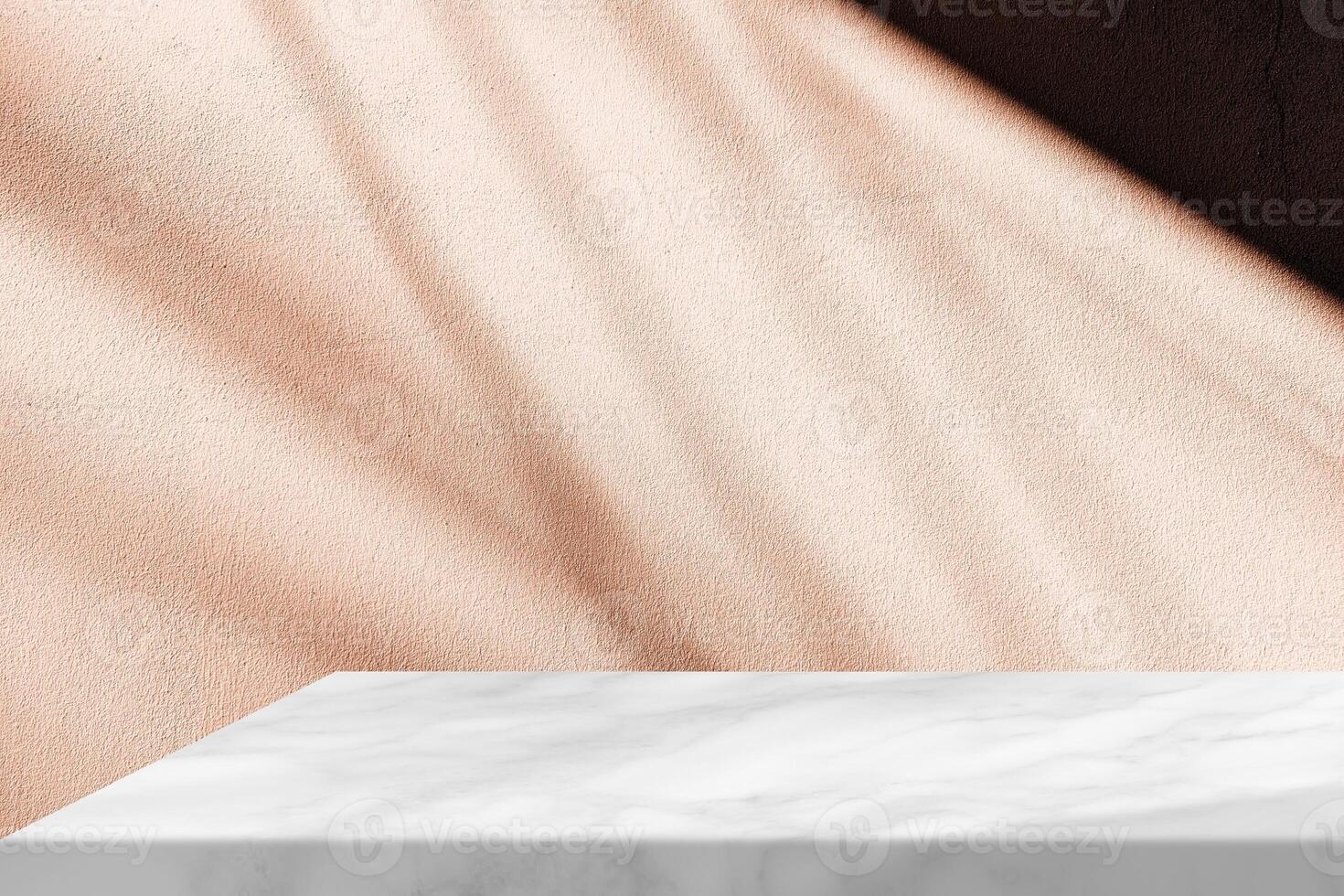Marble Table Corner with Mocha Mousse Stucco Wall Texture Background with Light Beam and Shadow photo