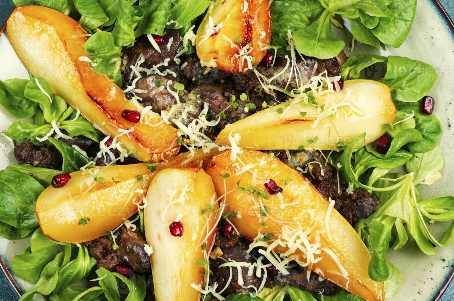 Pear and chicken liver salad. photo