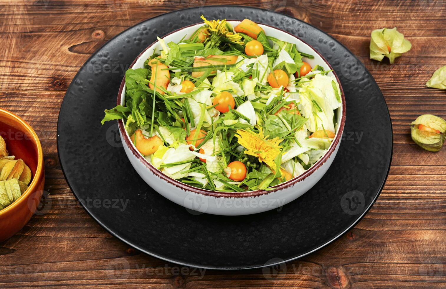 Salad with physalis and field grass photo