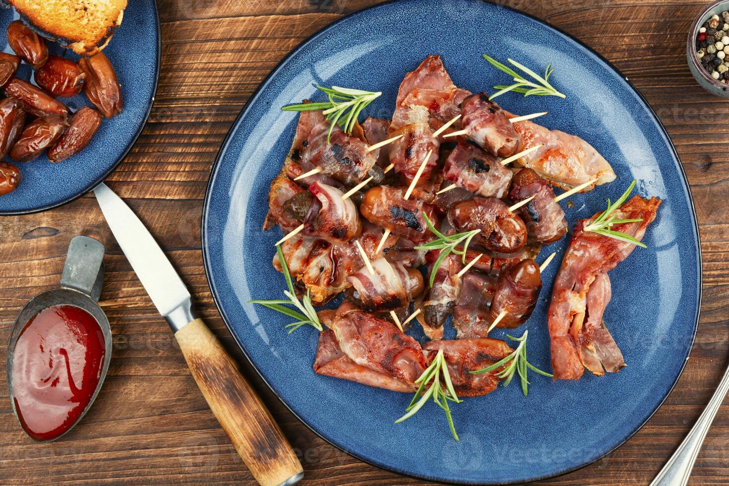 Elegant appetizer featuring bacon-wrapped dates. photo