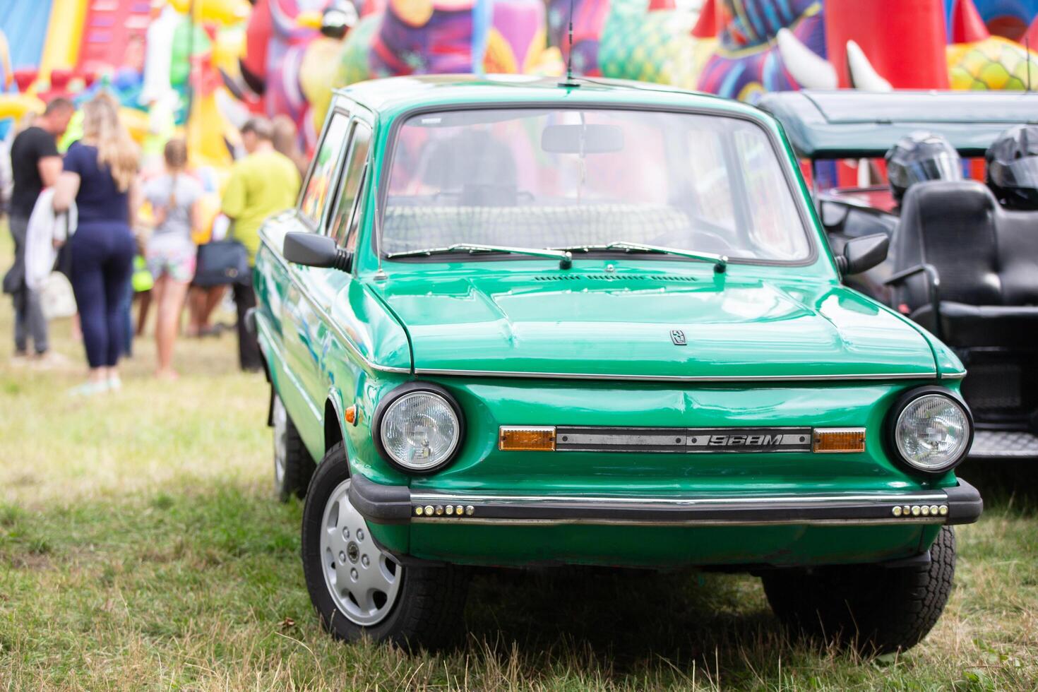 July 29, 2023. Belarus, the village of Lyaskovichi. A celebration of national cultures. Vintage retro car green Zaporozhets. photo