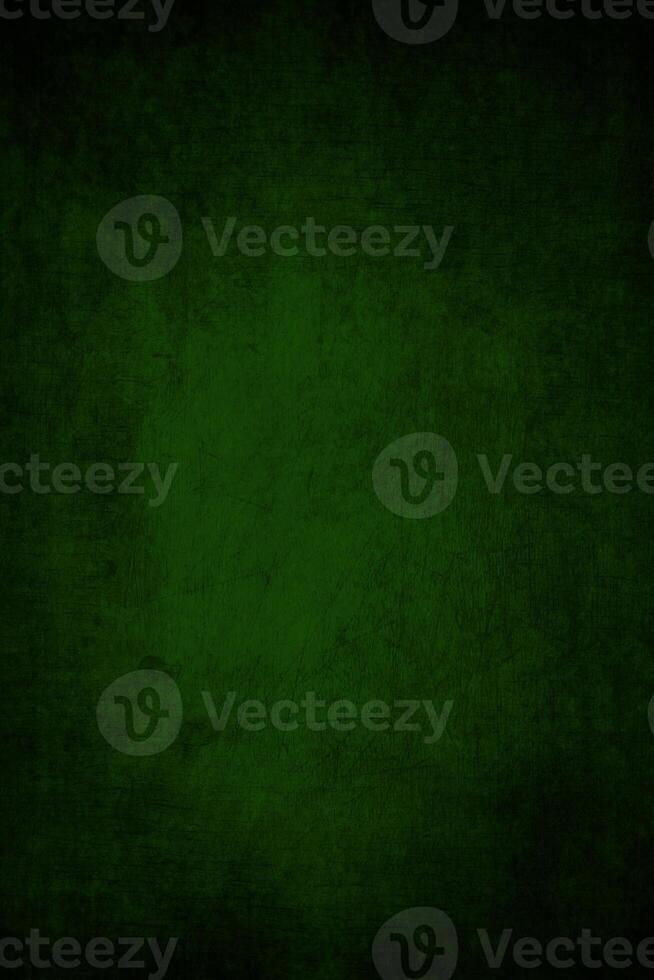 Abstract dark green rich background with grunge vignette with scratches and cracks. photo